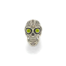 Load image into Gallery viewer, This is Peridot Skull Ring in Sterling Silver with intricate detail, looking like something straight out of Terminator. The Peridot eyes make this piece really pop when sparkling in the light
