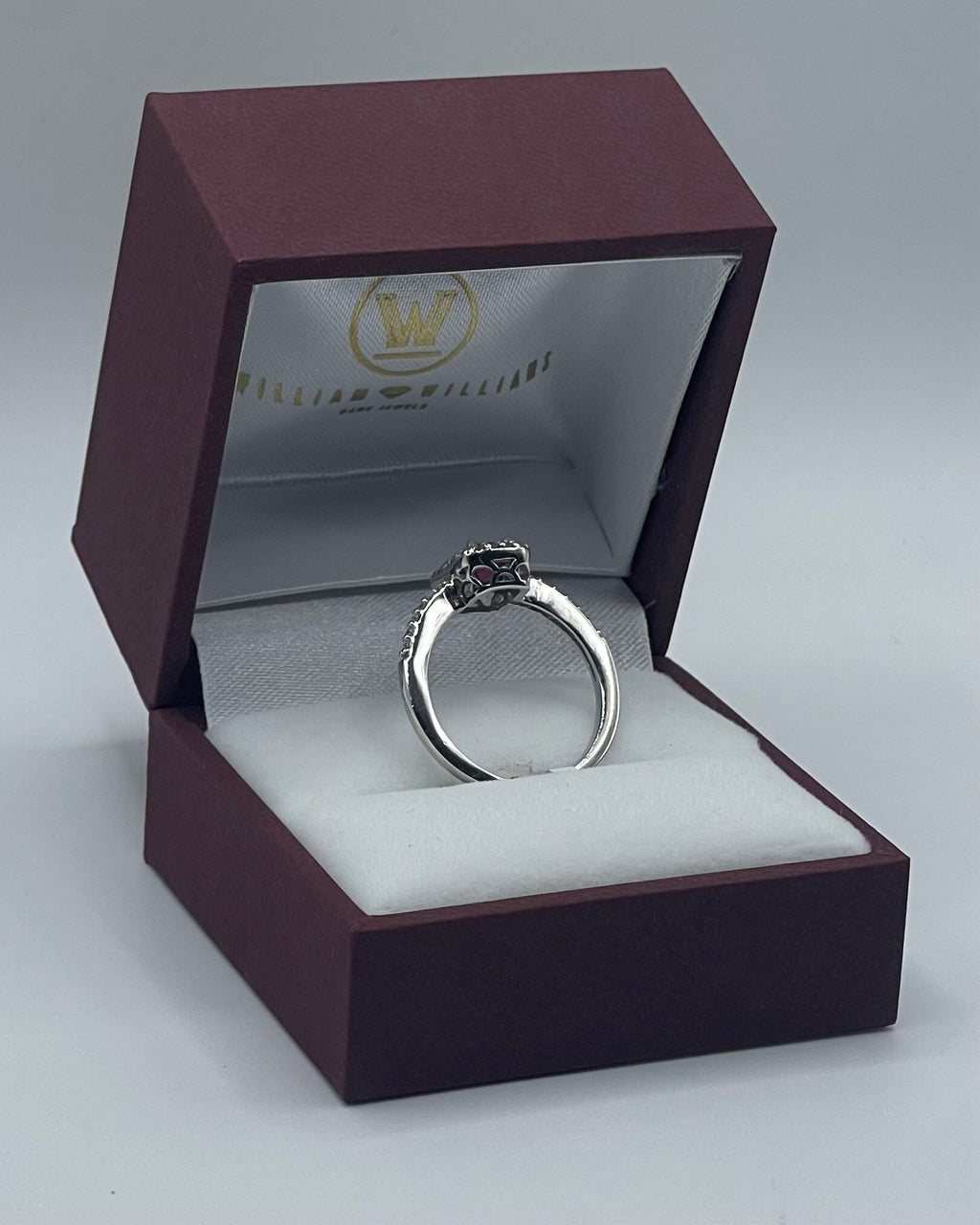 Exquisite 14k White Gold 0.75ct Emerald-Cut Ruby and 0.25ctw Diamond Halo Ring