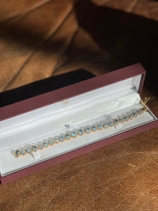 18K Yellow Gold Graduating Cabochon Aquamarine and Diamond Bracelet, 23.32ct Aquamarine, 1.70ct Diamond