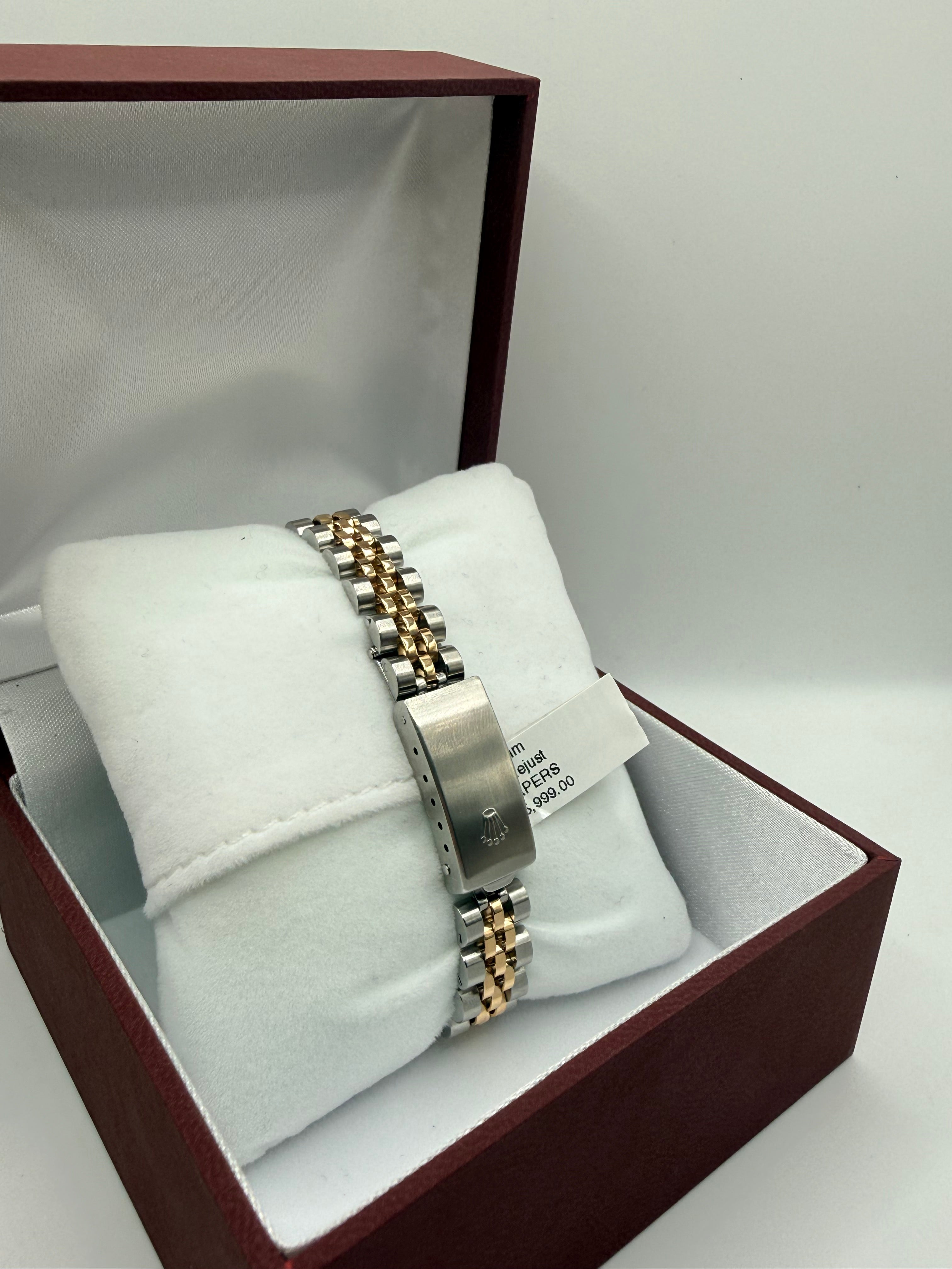  bracelets in a jewelry box with a white interior