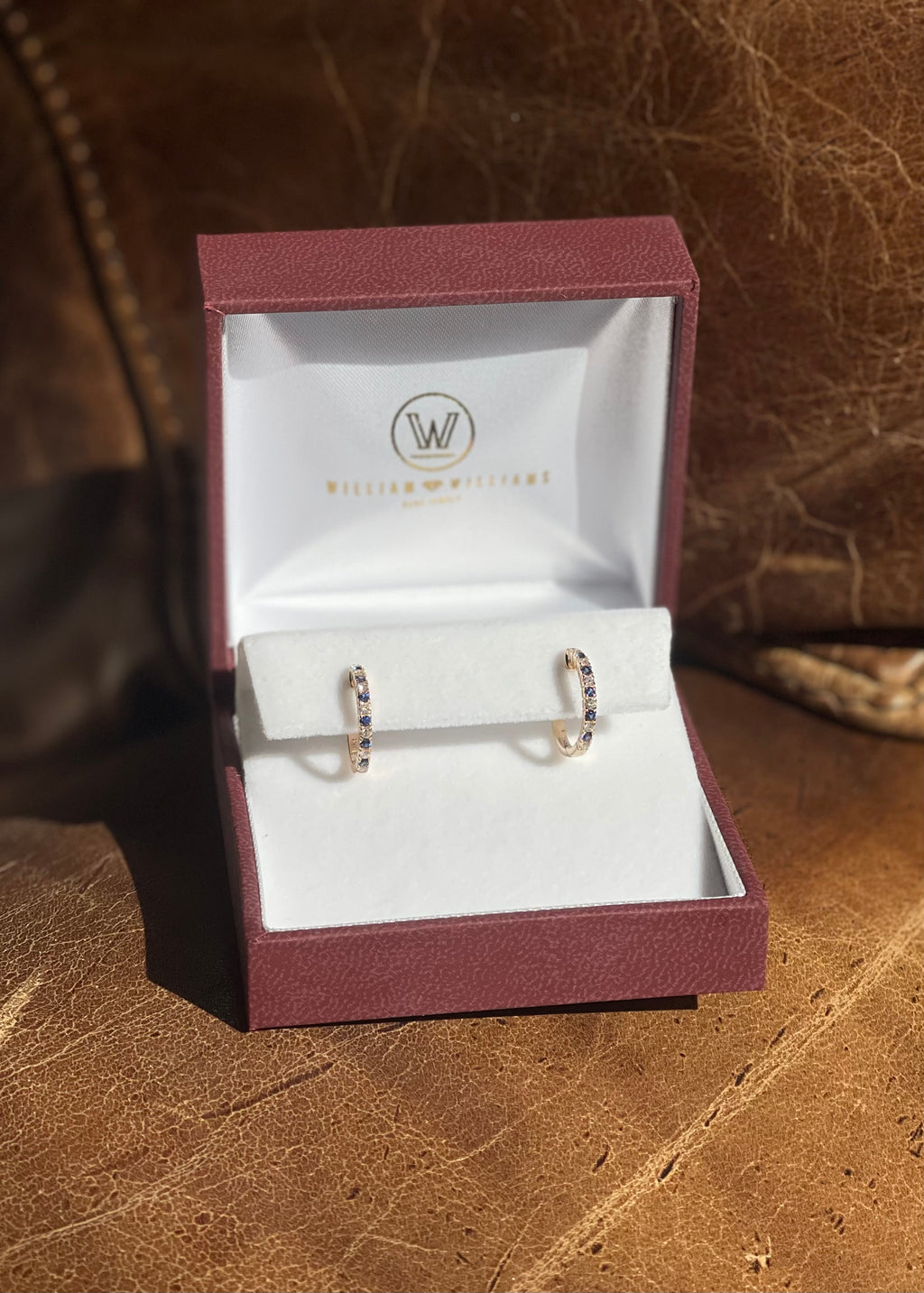 14k Yellow Gold Alternating Diamond and Blue Sapphire Huggie Earrings