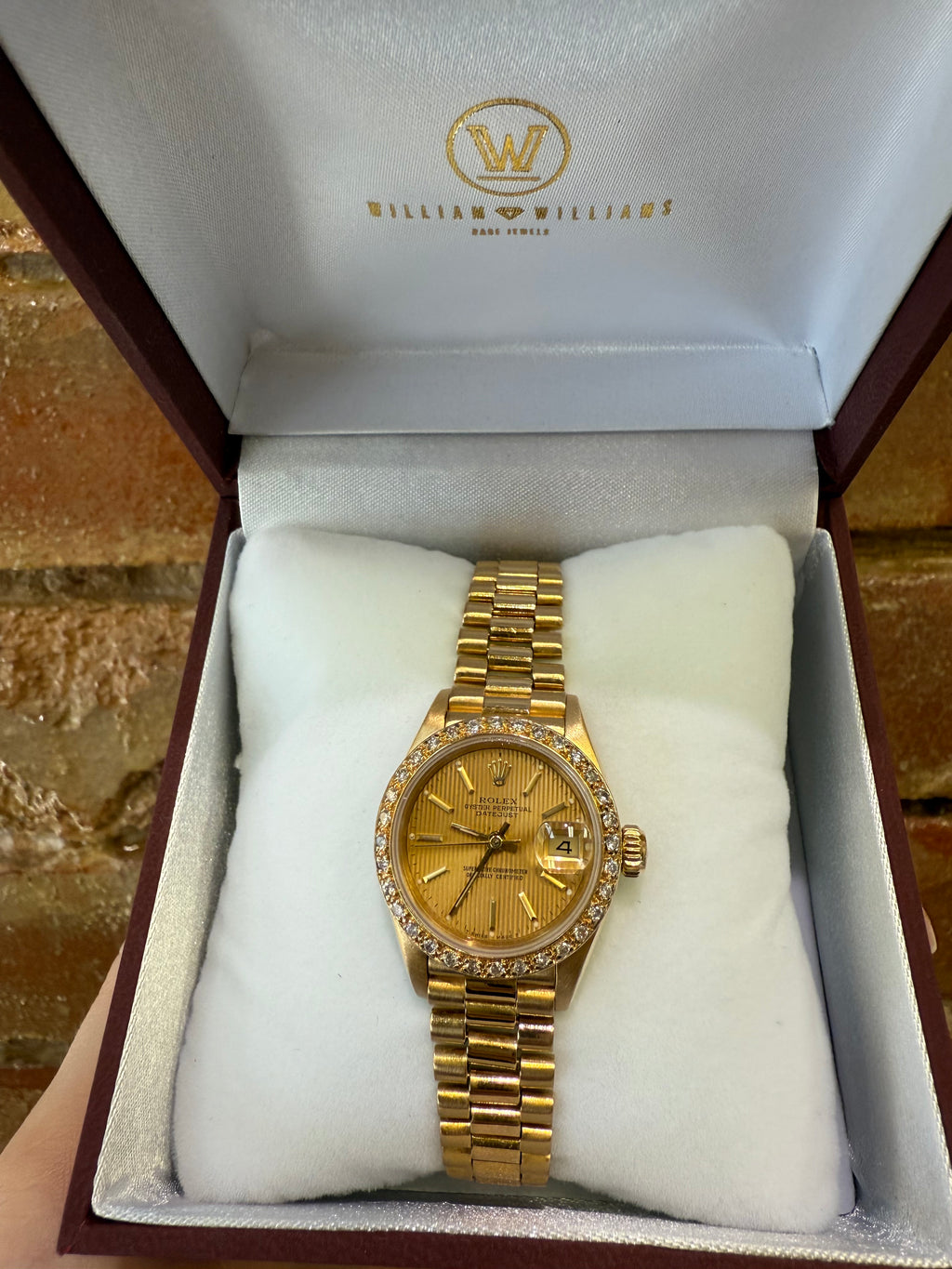 Gold ladies Rolex watch in a branded box