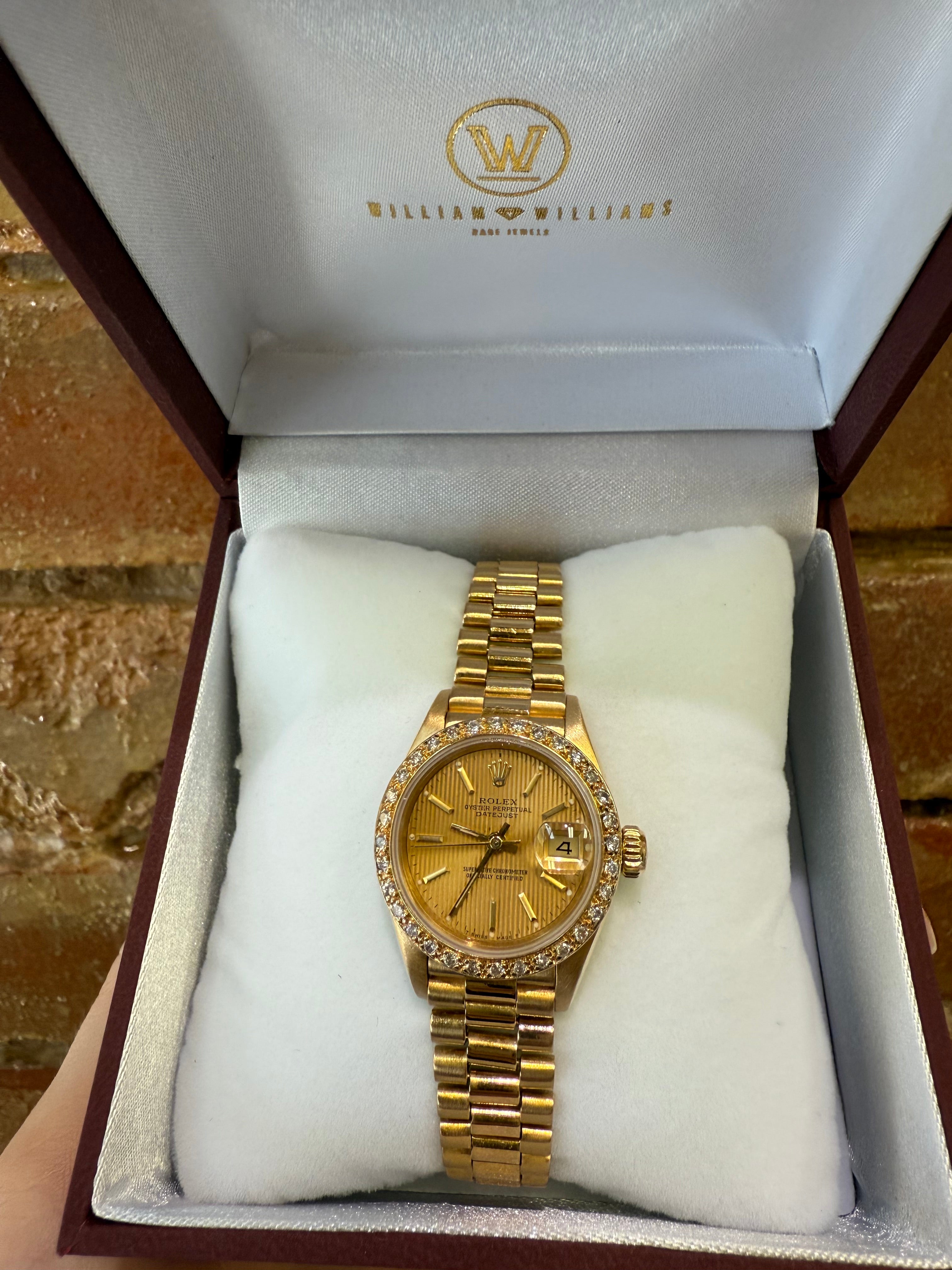 Gold ladies Rolex watch in a branded box