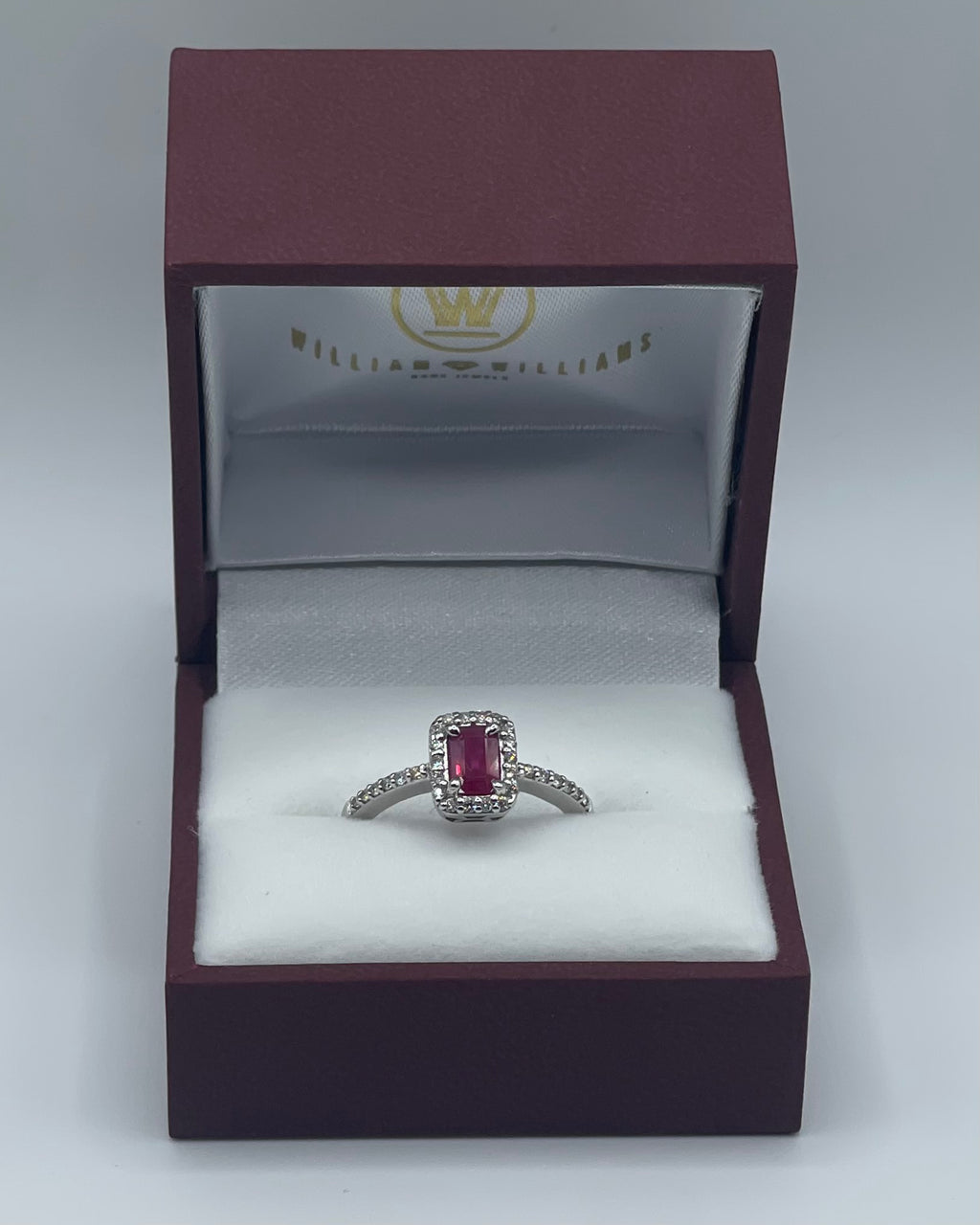 Exquisite 14k White Gold 0.75ct Emerald-Cut Ruby and 0.25ctw Diamond Halo Ring