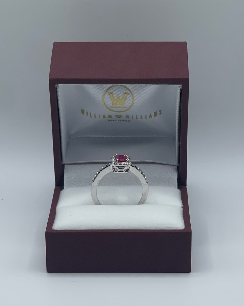 Exquisite 14k White Gold 0.75ct Emerald-Cut Ruby and 0.25ctw Diamond Halo Ring