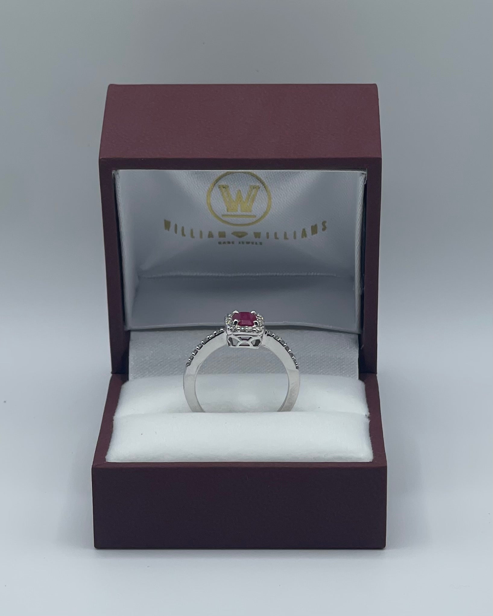 Exquisite 14k White Gold 0.75ct Emerald-Cut Ruby and 0.25ctw Diamond Halo Ring